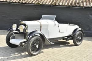 White Talbot AO90 Le Mans recreation racing car parked in a cobbled yard