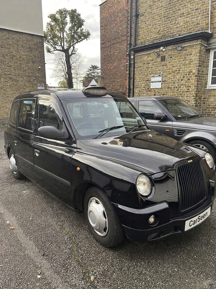 Black London taxi of the Austin FX4 lineage parked on a city street