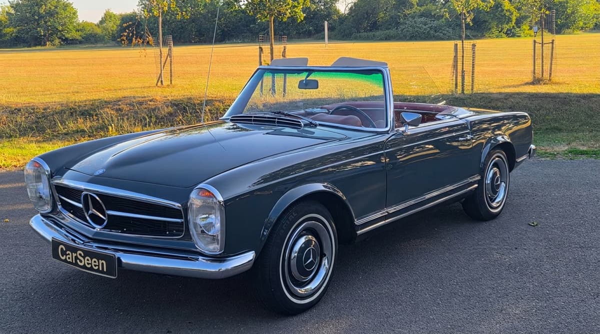 Dark green Mercedes-Benz 280SL Pagoda at the edge of a park in evening light