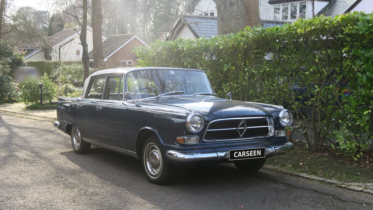 Front three-quarter view of the 1961 Borgward P100 in blue with a white roof