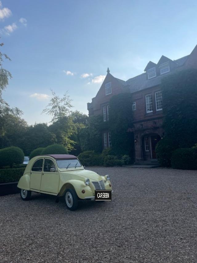 1958 Citroën 2CV in primrose yellow with burgundy canvas roof